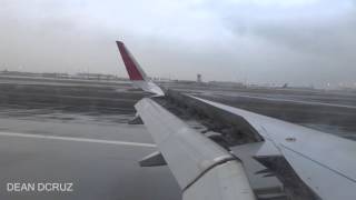 Air arabia a320 landing on a wet morning at sharjah international
airport inbound from trivandrum .