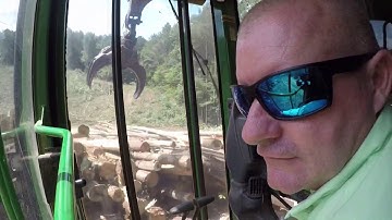 Tigercat 635 pulling & John Deere loader loading hardwood pulp