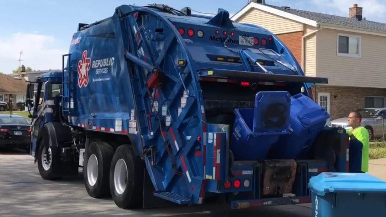 Rear Loader Garbage Truck Eating Garbage Cans