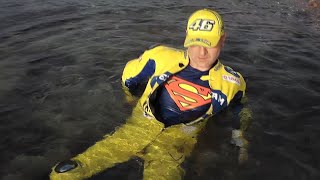 Superhero with yellow VR46 replica Bikesuit in the sea