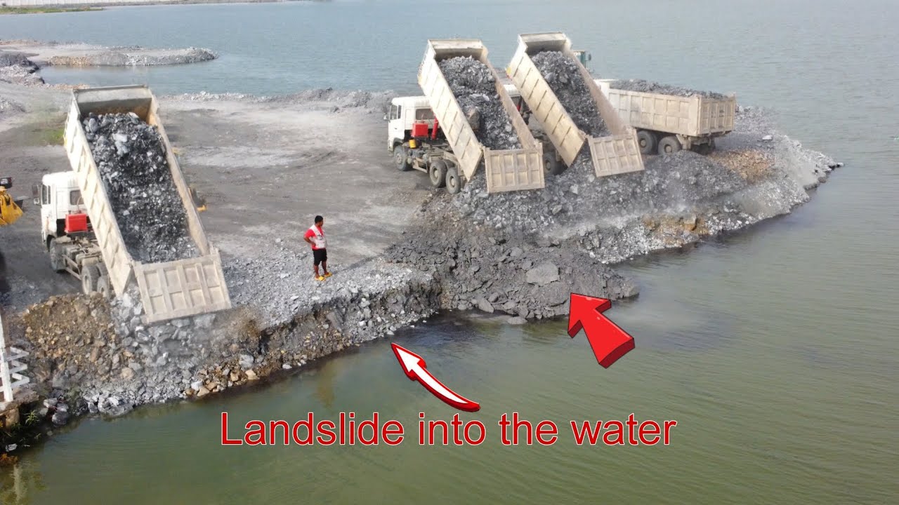 Amazing Land slide Sinking into the water No problem Continued working by team work machinery