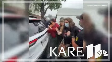 Large crowd protests raid on Minneapolis restaurant