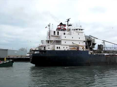 A Tug Boat reversing on the stern of a ship. Chicago IL. March 2012 ...