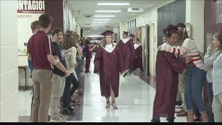 Henderson County seniors take 'graduation walk' through former schools