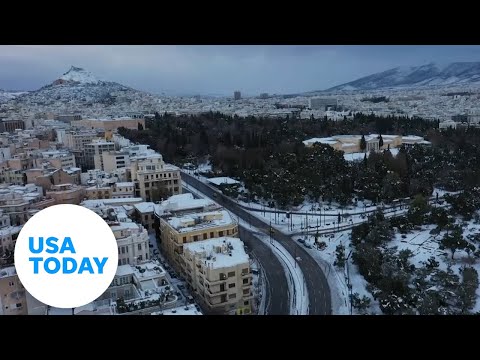 Athens, Greece coated in glistening snow | USA TODAY