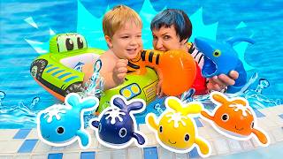 Dorian, Lucky the toy bunny and Maria are playing with toys in the bathtub and kiddie pool.