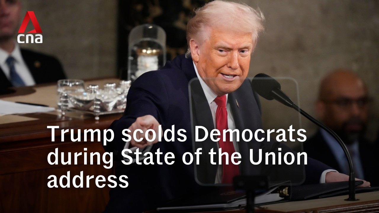 Trump scolds Democrats for not standing in State of the Union address, heckled by Ilhan Omar