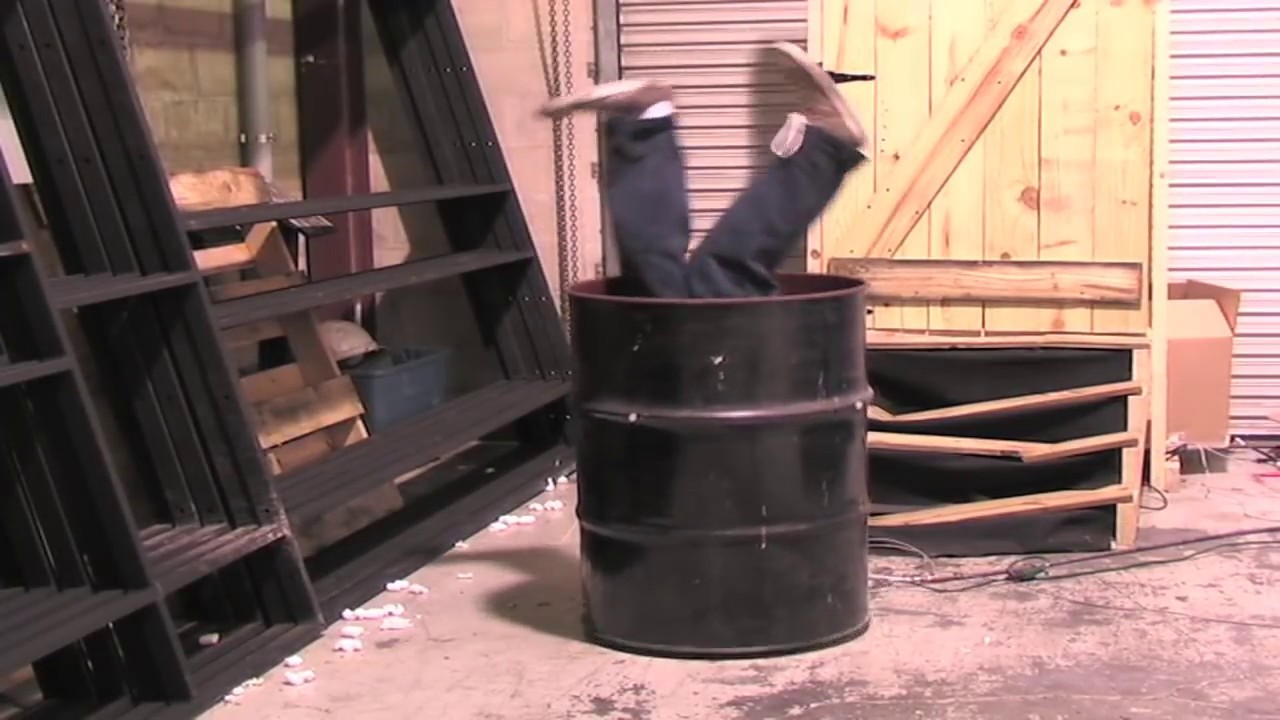 Halloween prop upside down person stuck in drum
