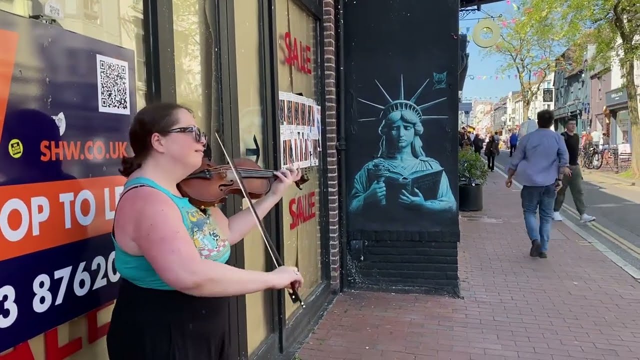 Violinist Becca, from Buffo's Wake band, busking in Brighton North Laine.