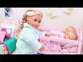 Mommy and twin baby dolls family routine in dollhouse with toys