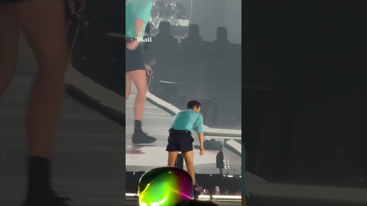 Harry Styles collapses on stage after 'choking' on water