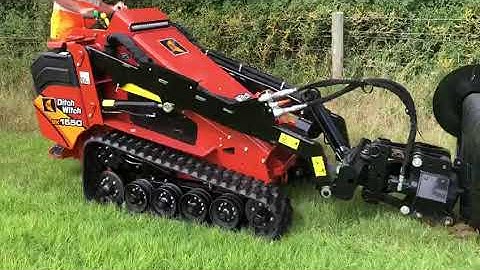 Ditch Witch Mini Skid Steer installing Newt Fencing