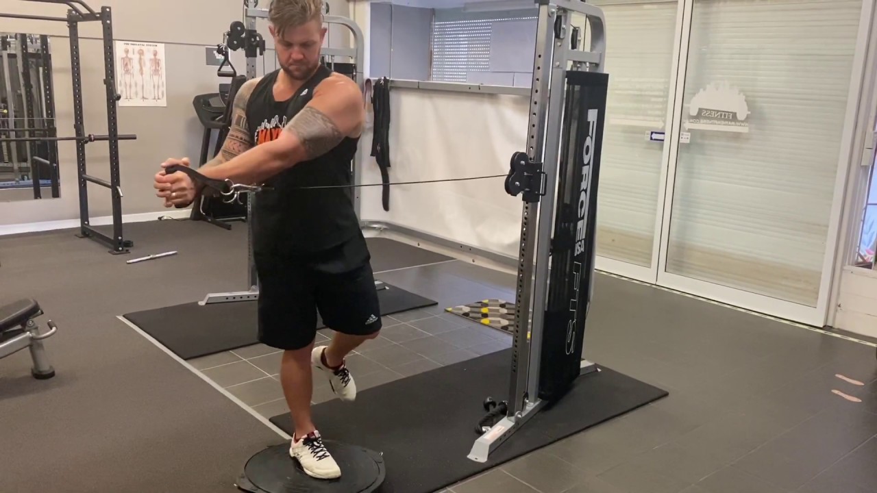 Single Leg Balance with Band Twist Demonstration \\ Mayhem Fitness