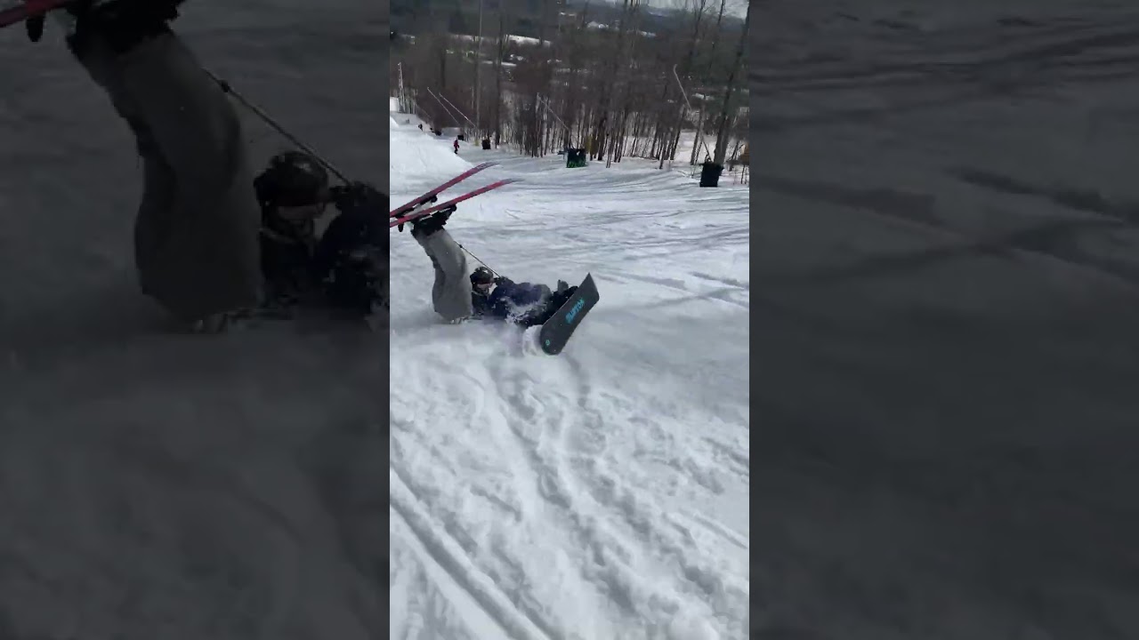 Skier does 360 and grinds rail and crashes into boy on snowboard