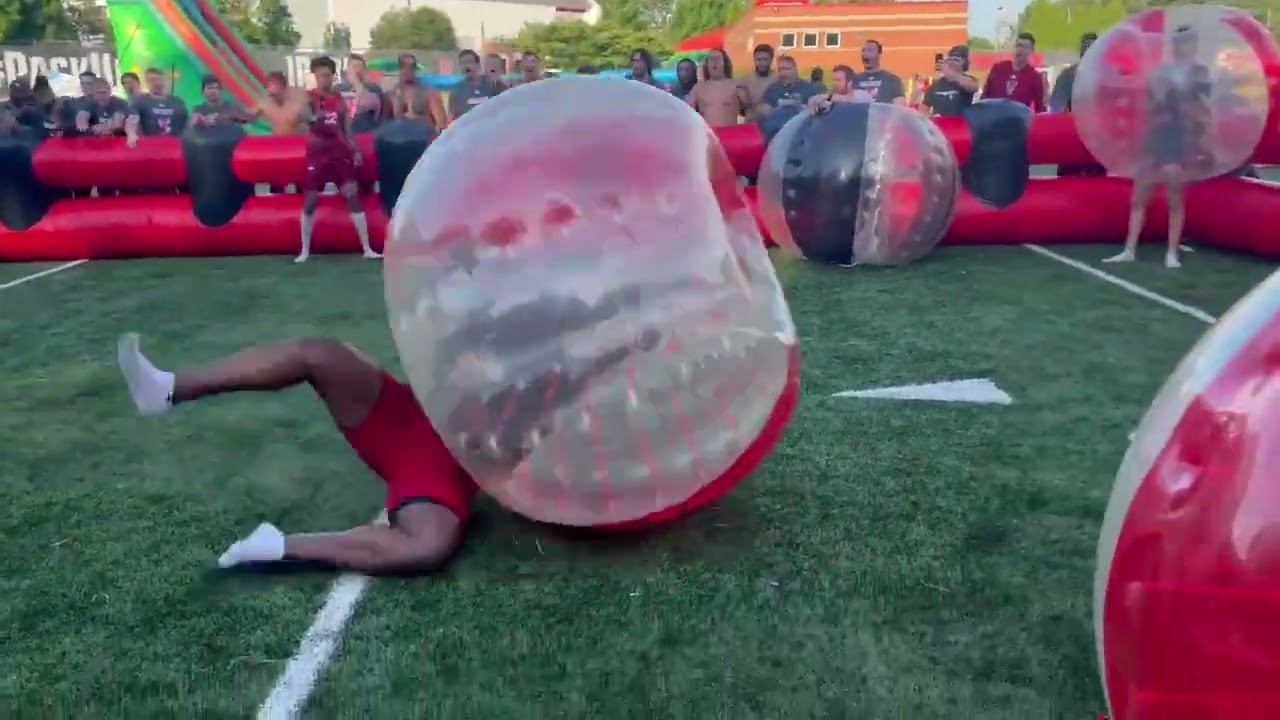 NC State football players have some fun with battle balls 😂
