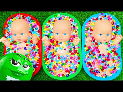 Three Baby Dolls Sorting Beads into Three Bowls