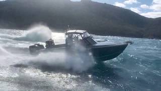 Two Edencraft 233s punching side-by-side in Coles Bay, Tasmania