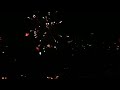 Dutch New Years Firework with red object fly in sky