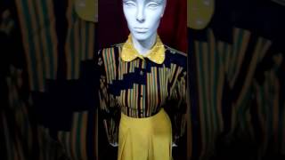 Yellow Kissing Pleetted Skirt And A Silk Shirt With A Pearl Studded Collar