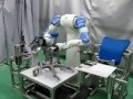 Motoman dual arm robot assembling a chair
