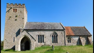 All saints  Tattersett  and  a  Jaguar  in a  field