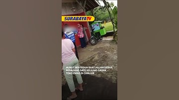 Thumbnail of NUNUT BERTEDUH SAAT HUJAN DERAS, PEDAGANG SATE KELILING GASAK TOKO EMAS DI CIANJUR #surabayatv