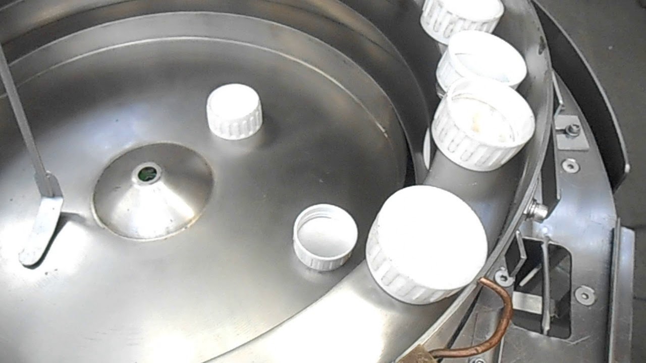 Alimentador vibratorio de tapa