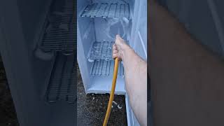 Cleaning a freezer that frosts up with a hose of water. screenshot 4
