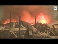 California fire destroys thousands of structures, residents scramble to flee