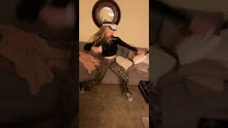 Girl punches the air while playing game on v/r virtual reality glasses then falls forward