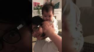 Daughter loves to ride on mommy's neck