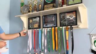 Here is a trophy shelf that I built that holds medals, trophies and pictures. The pictures have magnetic tape that make them easy to 