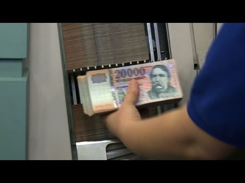 Hungarians burn money to keep warm