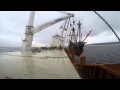 The Halve Maen  being lifted onto the Big Lift ship in Narragansett Bay in April 2015