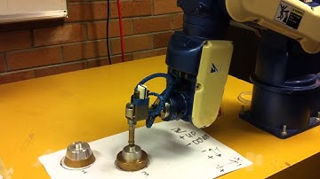 Robot Arm programmed to solve "Towers of Hanoi"