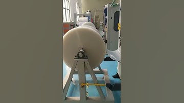 thermoforming machine making PP lids with robot hand