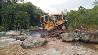 Excellent CATERPILLAR BULLDOZER D6R XL works to make a way across a big river