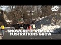 Snow and ice linger across DC as cleanup stretches into second week