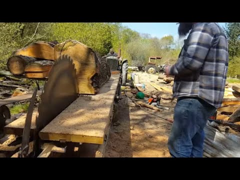 tractor-powered-sawmill-in-operation---cutting-planking-oak