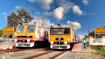Very different and perfect EMU local train crossing