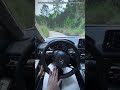 The driver is showing a "First Person View" while navigating a narrow, forested road in a Honda.