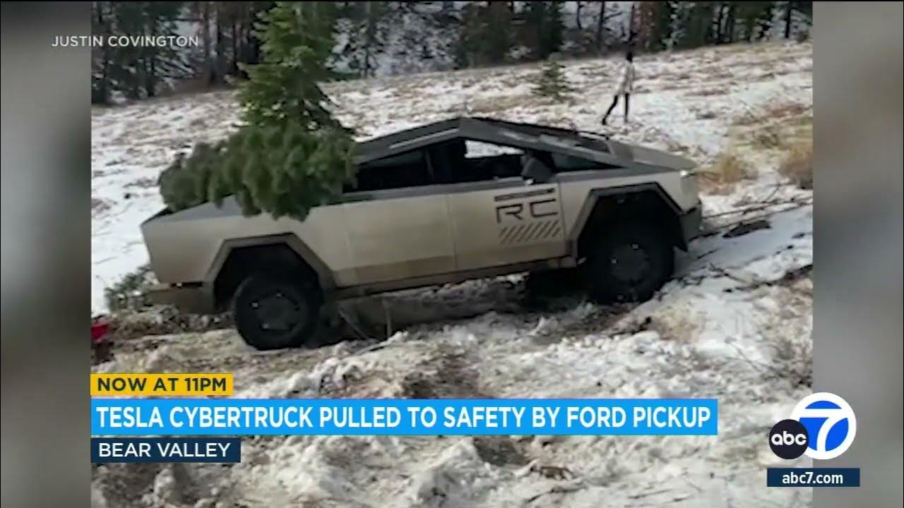 Tesla Cybertruck pulled to safety by Ford pickup after getting stuck in