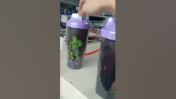 Automatic plastic bottle shrink wrapping machine