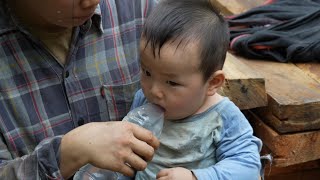 Single mother tries every day to build a new house out of wood