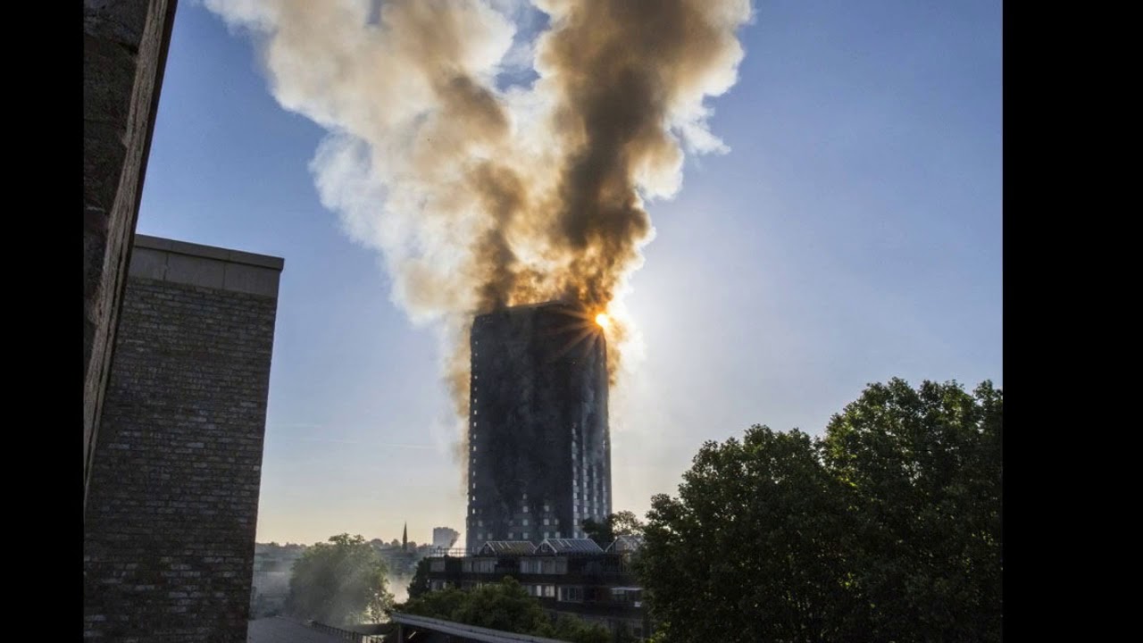 Ten fire engines sent to battle blaze as flames billow from top floor of three storey luxury apartme