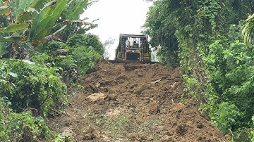 Bulldozer D6R XL Old Road Service in Repairing Plantation Roads