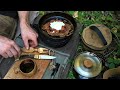 Bacon egg  hashbrown skillet cooked on a split log stove