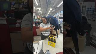 CASHIER bravely HOLDING THE LARGEST PARROT IN THE WORLD THE HYACINTH MACAW!