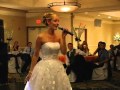 Katie sings to John at their wedding.