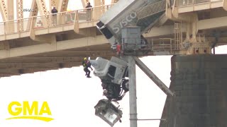 Video shows moment semi truck goes off bridge